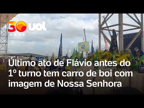 Apoiadores de Flávio Bolsonaro levam imagem de Nossa Senhora em última agenda antes de eleição