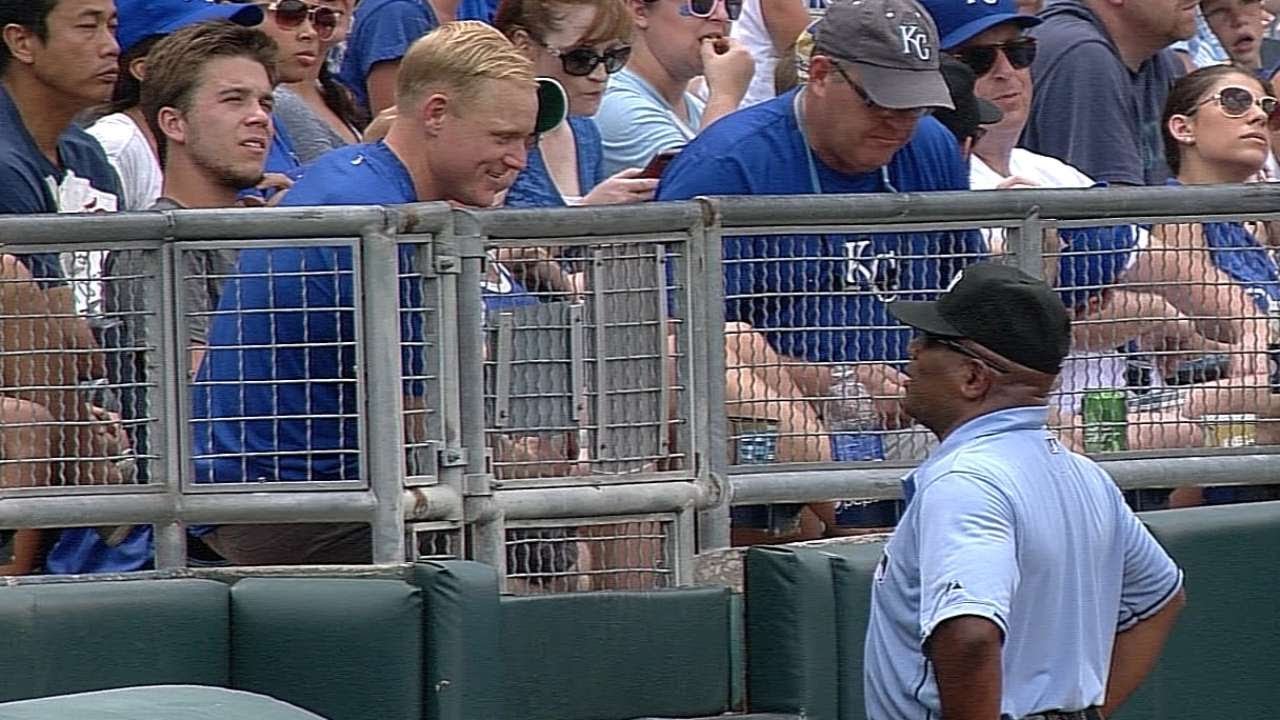 Umpire Laz Diaz greets a U.S. Army veteran