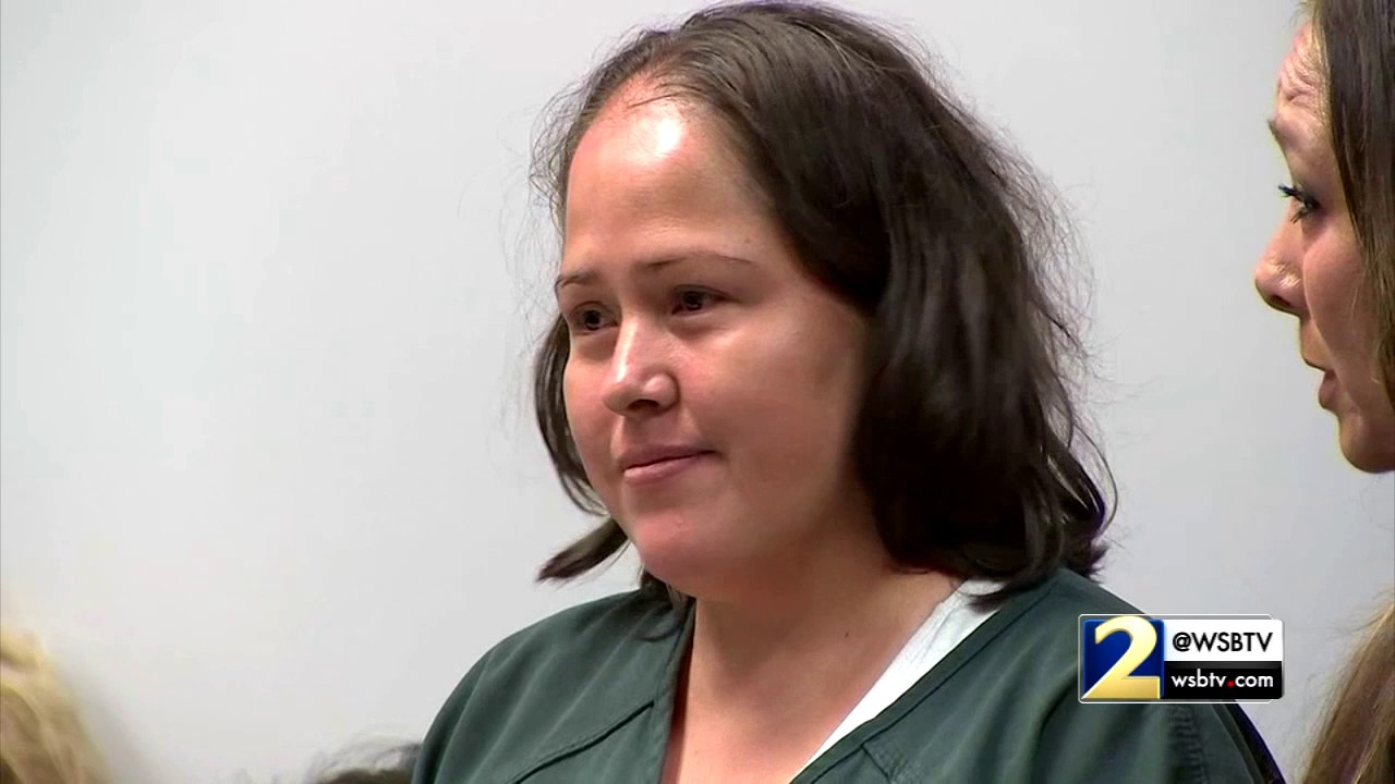 RAW VIDEO: Mother accused of killing family bows, gives thumbs up in bizarre court appearance