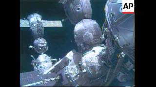 WRAP Soyuz docks at space station, adds crew inside