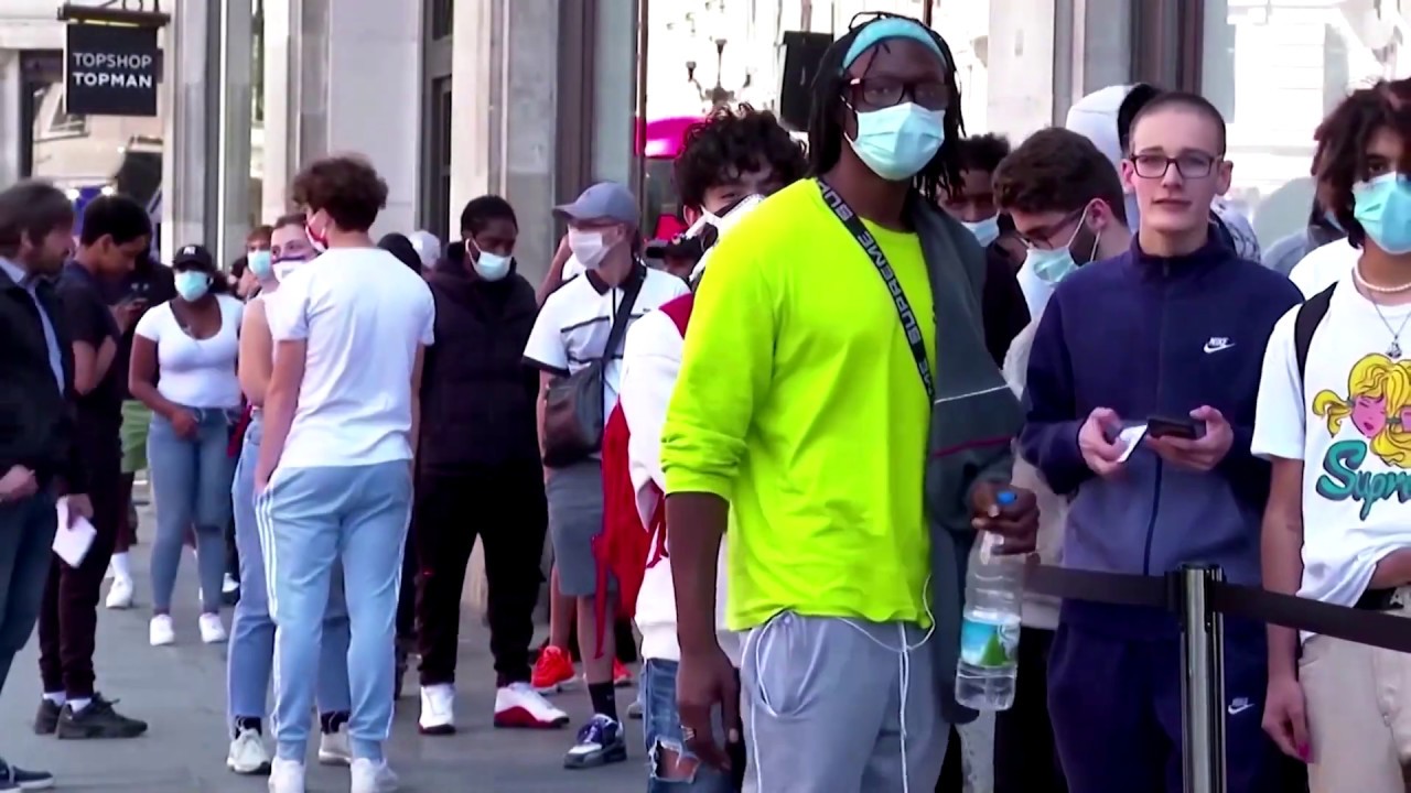 Long lines as stores reopen in England