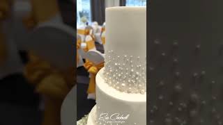 This beautiful white on white wedding cake with a touch of edible gold leaf 🤍💛 #gold #whitewedding