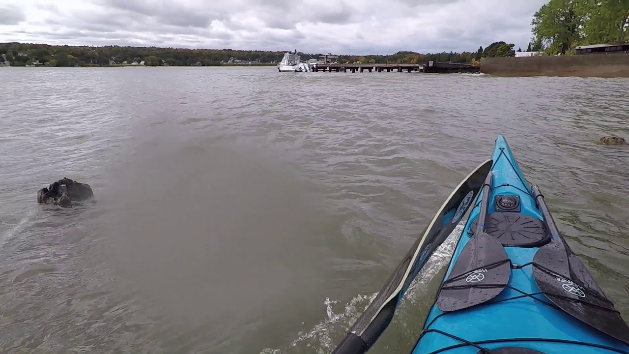 Kayak surfing the pilings in Grand Marais Harbor YouTube