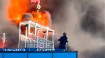 Man rescued from burning high-rise building under construction by crane operator by the roof!