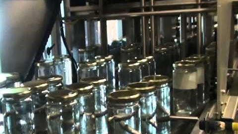 Tray Former-Loader and Inline Shrink Wrapper for Glass Jars