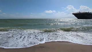 Walking next to the water waves to see the USS Lexington aircraft carrier in Corpus Christi Texas