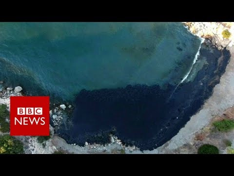 Oil spill turns Greek island bay black - BBC News