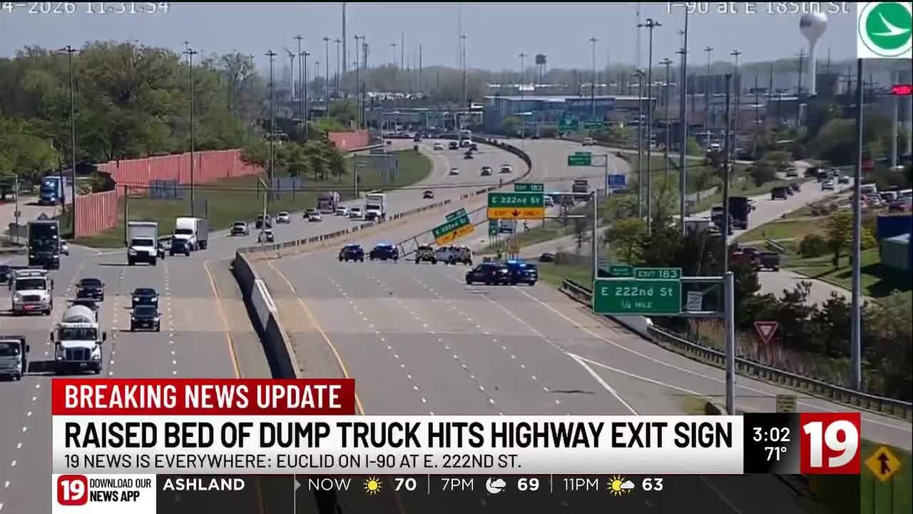 Raised bed of dump truck hits I-90 highway sign - YouTube