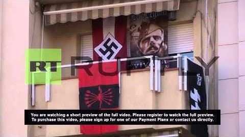 Spain: Nazi-neighbour hangs flags of fascism from residential block