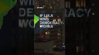 Information Anonymous artist projects protest messages in Sao Paulo ahead of runoff Guide