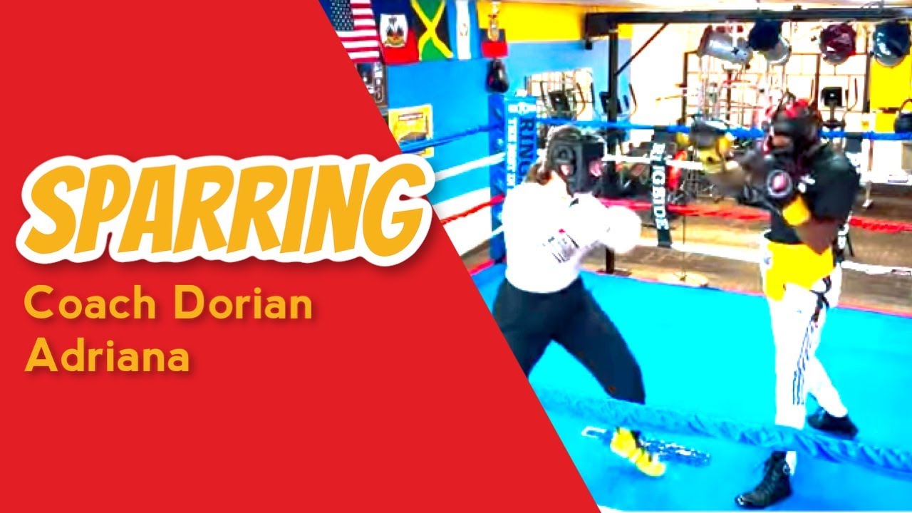 Coach and  Female Fighter sparring for her up coming fight