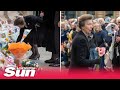 Princess Anne receives flowers from young girl on visit to Glasgow