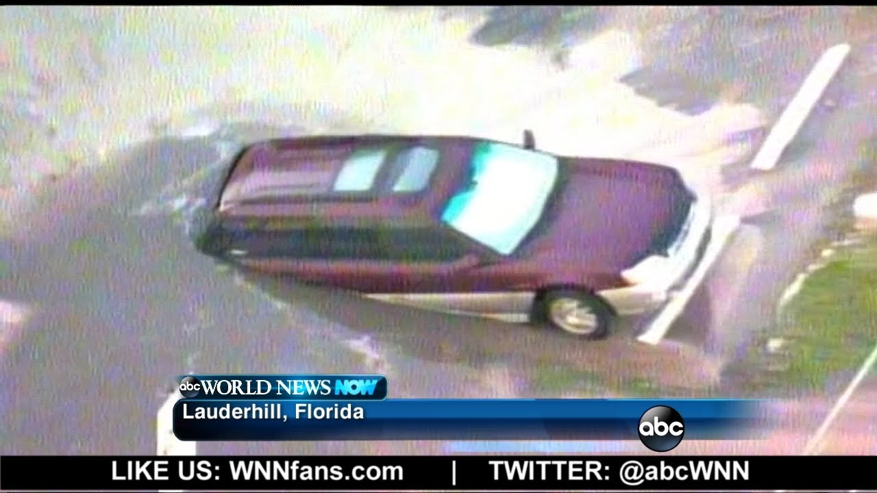 Sinkhole Swallows Car after Truck Hits Fire Hydrant - YouTube