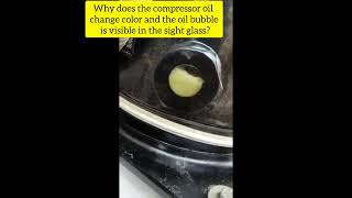 Why does the compressor oil change color and the oil bubble is visible in the sight glass