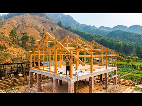 A Woman Building A Wooden House Frame And Installing A Strong Roof With Her 5-Year-Old Son