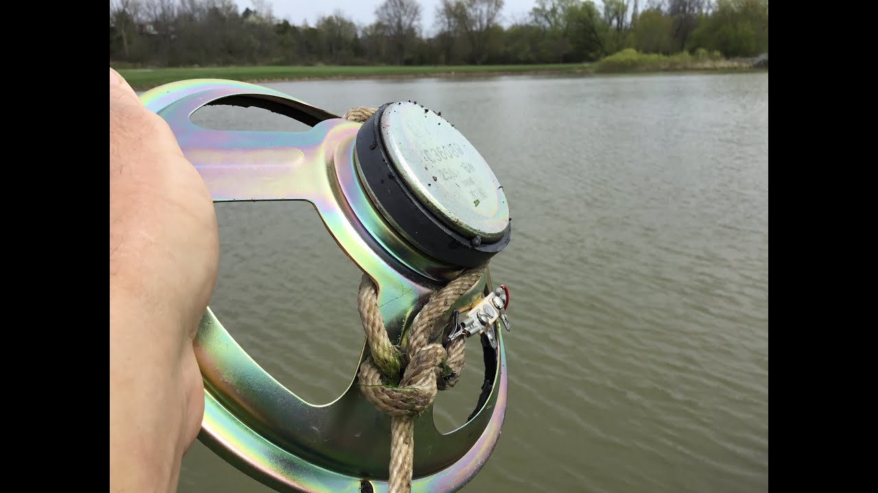 Magnet fishing with a large speaker magnet.