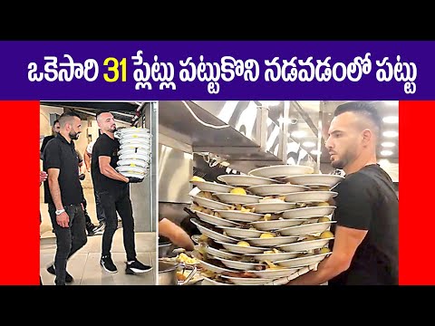 Israeli waiter carrying 31 plates at once || 31 dishes of food, weighing about 60 kg