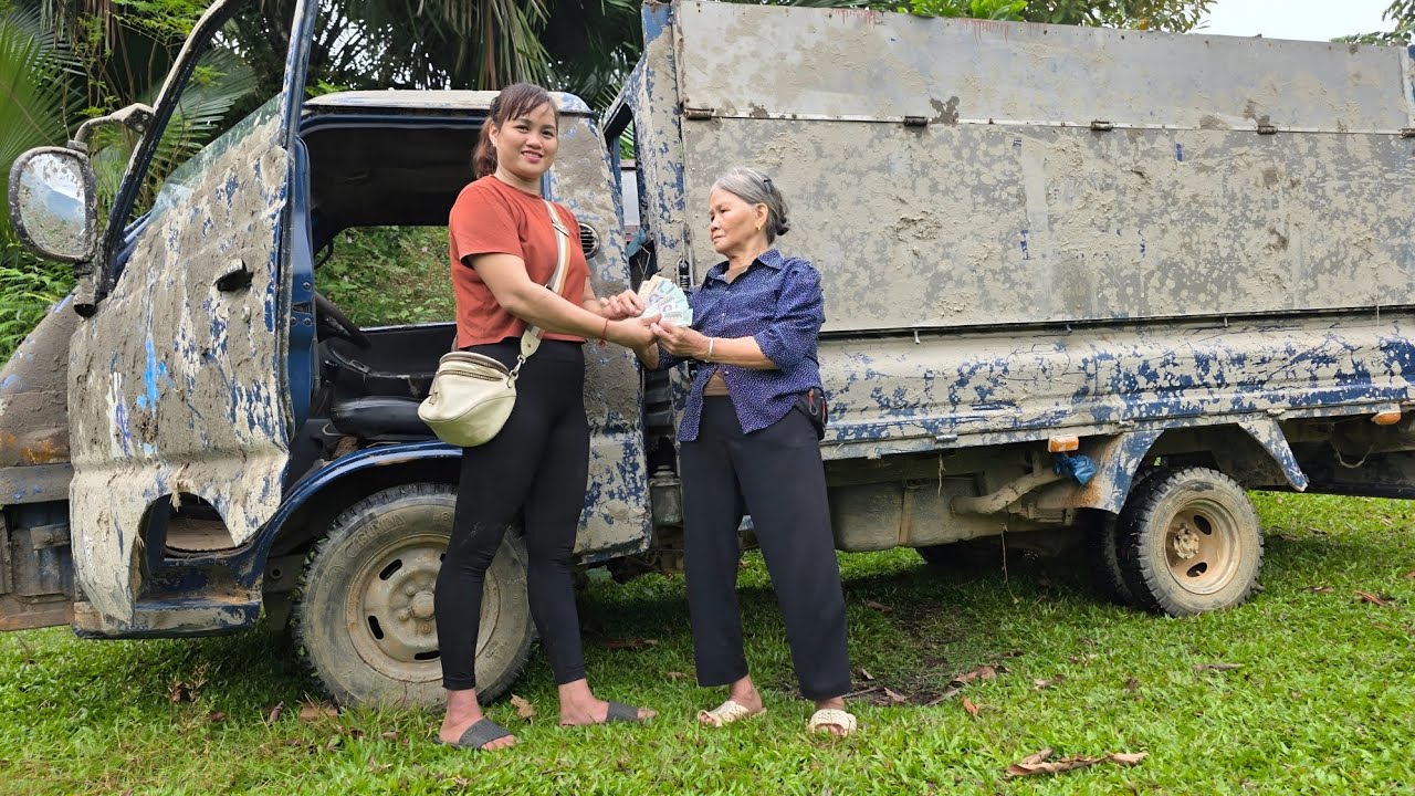 Girl repairs and restores old scrap trucks.