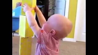 cute baby stacking blocks and feel super excited n dancing