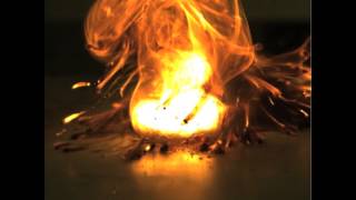 A hypergolic ignition of a liquid drop and a powder