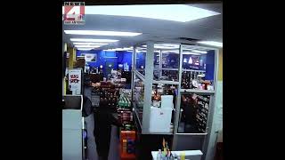 DRAMATIC VIDEO: Safety glass protects clerk when armed robber opens fire