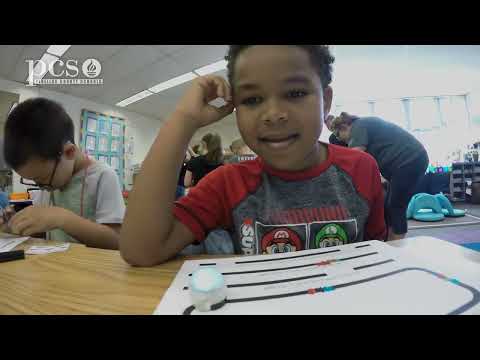 First grade students learn about coding with Ozobots!