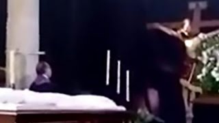 Crucified Jesus statue moves its head during Good Friday Mass