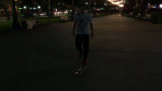 My friend is practicing his skateboard Tricks