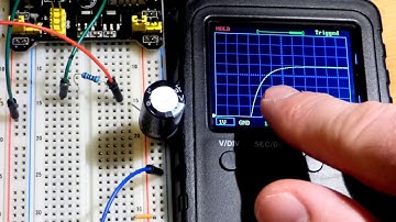 Capacitor component basics demonstrated with LEDs and oscilloscope measured for electronics