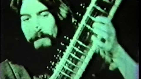 George Harrison playing sitar on a TV show