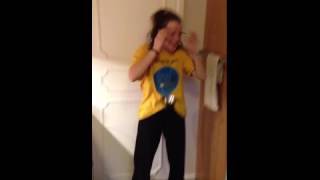 Teen girl screams when someone pours water down a funnel ...