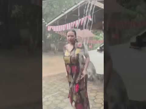 beautiful aunt bathing in the heavy rain