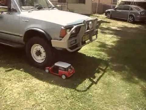 mini-cooper-crushed-by-a-nissan-truck