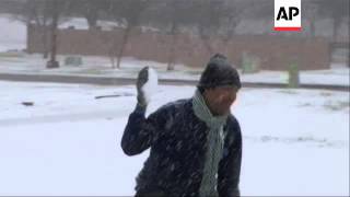 A Texas snowstorm has closed schools, snarled travel and forced a main highway to Oklahoma to shut d