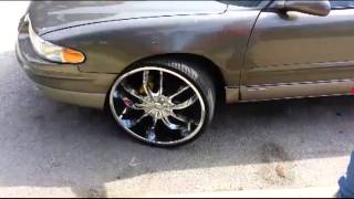 2000 buick regal on 24's  cut wheel and put spacer
