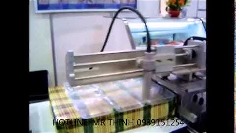 Máy in phun LINX   kết hợp với cơ cấu di chuyển đầu in