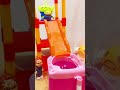 Alien parent and child jump into washing machine
