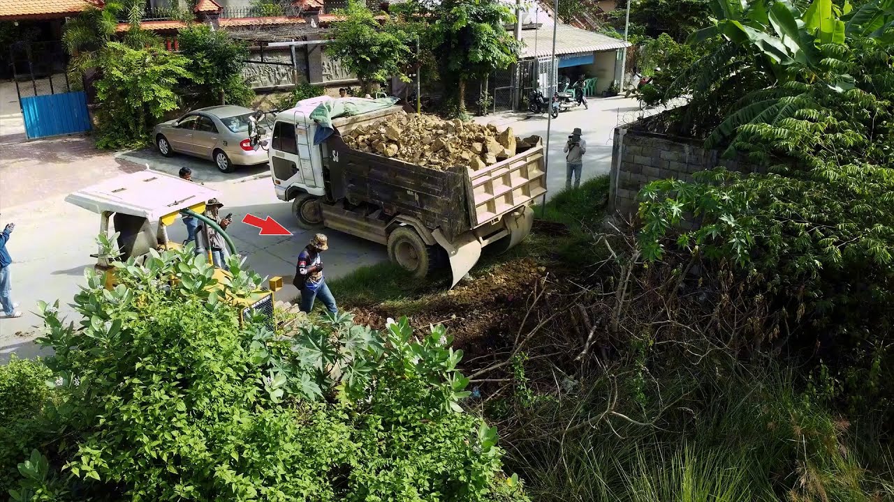 Amazing Start New Landfill Use Dump Truck Unload Stone with Skill D20P Dozer Pushing into Flood Area