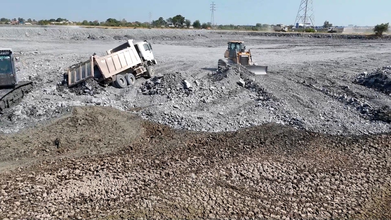 Amazing Process Bulldozer Clearing Stone and Mud to an Even Height and Dump Truck Transport Stone