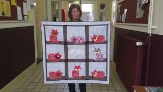A quilt to connect four generations: Cats, handkerchiefs and a piece of embroidery
