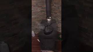 Cast Iron Dragon Steamer Pot On A Wood Stove