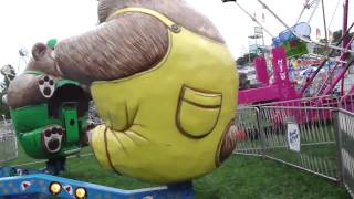 Nora and Ashley ride the Bears at the fair