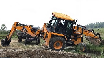 River Mix Ballast Being Loaded on A Tractor By JCB Backhoe Machine