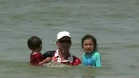 Catrina and Thomas while taking a dip on the beach