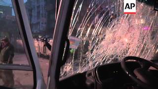 Clashes between protesters and riot police after passage of anti-protest law, bus on fire
