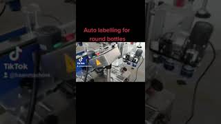 Auto labelling for round bottles