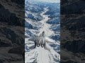 F-15E Strike Eagle taking the high line through the snow-capped valleys
