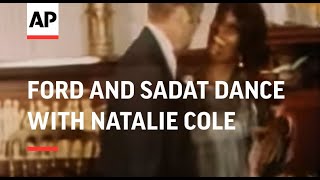 SYND 29 10 75 PRESIDENTS FORD AND SADAT DANCE WITH NATALIE COLE IN WASHINGTON