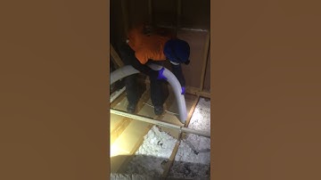 Carl Removing Contaminated Insulation from an Attic