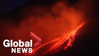 Burning lava from Italy's Mount Etna illuminates night sky